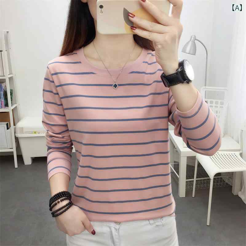 早秋の 新型の 大きい サイズの ゆったり した 純綿の 長袖の t シャツの 女性の 秋の 服の 外は ストライプの 底の シャツの 体重の 上で 服を 着ます。