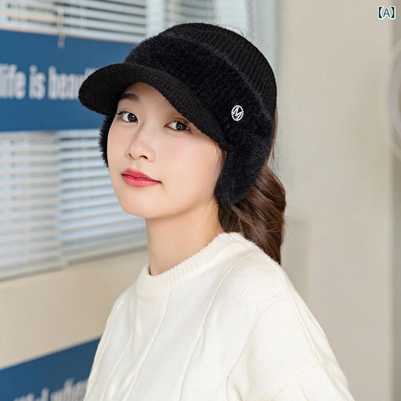 ニットの 空の 帽子の 女性の 秋冬の 防風は 毛糸の アヒルの 舌の 帽子に 乗ります。