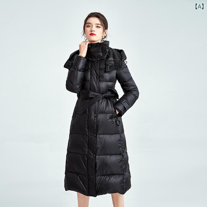 羽 绒服 女 过膝 长款 欧 洲 站 2025 冬季新 款收 腰高 端 亮 面 连帽 女 士 外套
