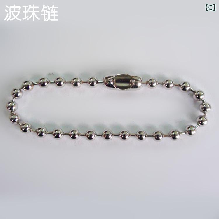 アップルの イヤ ホンの ケースを 適用 します。 銀色の 黒い 登山 ボタンの 包装 箱です。