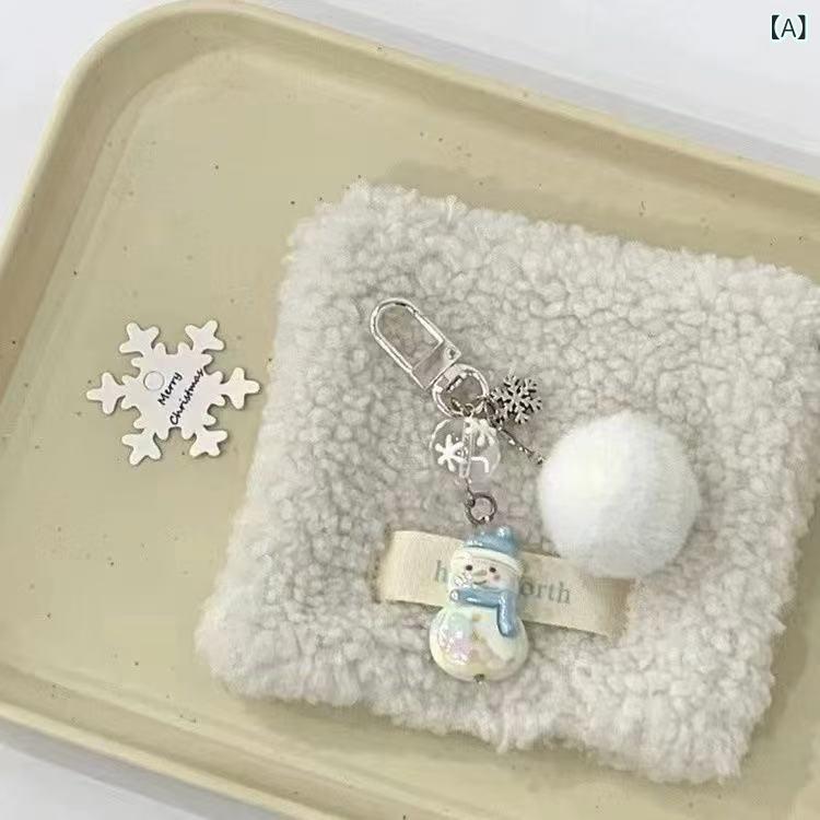 キーホルダー バッグチャーム カメラアクセサリー 冬 雪だるま 白 ポンポン 雪の結晶 かわいい 毛玉 チェーン 小動物 合金 カートゥーン スイート