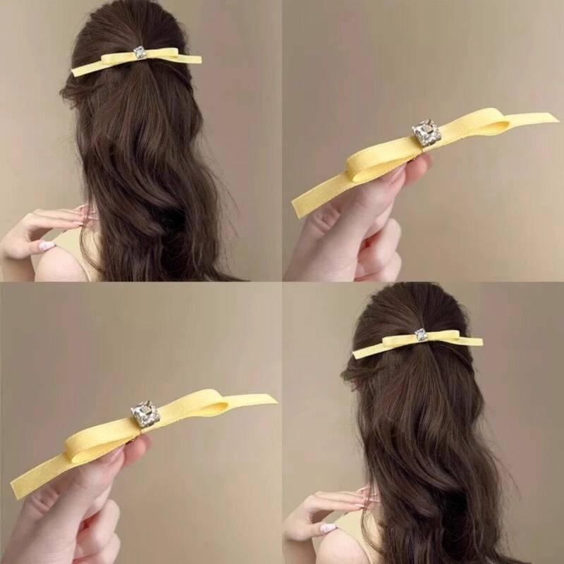 ・カテゴリ: ヘアアクセサリー・主な素材: 混合素材・処理技術: インレイ・ヘアピンの種類: サイドピン・カラー展開: イエロー（ラインストーン付き長バタフライヘアピン・1個入り）・モチーフ: リボンび・スタイル: フェミニン、スイート