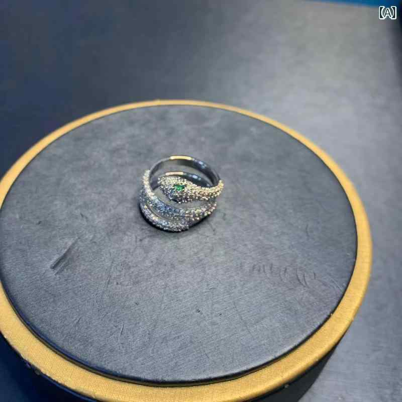 指輪 ペアリング 蛇モチーフ 緑眼 ジルコニア 電気メッキ加工 新年 ラッキーアイテ...