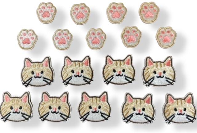 NekodaraK ワッペン 猫 肉球 2種類 18個 シールタイプ ネコ K-pop 推し活 アップリケ 刺繍 ミニねこ ミニ肉球セット内容: 可愛い猫の顔と肉球モチーフのワッペン各9個、合計18個入りのAmazonセット。愛らしいデザインで推し活やファッションアレンジに最適サイズ仕様: 猫の顔は3cm×2.6cm、肉球は1.8cm×1.8cmのコンパクトサイズで、様々なアイテムに使いやすい大きさ簡単装着: シールタイプで貼り付けるだけの簡単取り付け。布製品やバッグ、小物などどこでも手軽に装飾可能高品質デザイン: 刺繍仕上げで立体感のある上質な仕上がり。ベージュ、ピンク、ホワイトの優しい配色で可愛らしい印象多用途: 、バッグ、帽子、ノートなど様々なアイテムのカスタマイズに。K-pop推し活やハンドメイド作品の装飾に最適