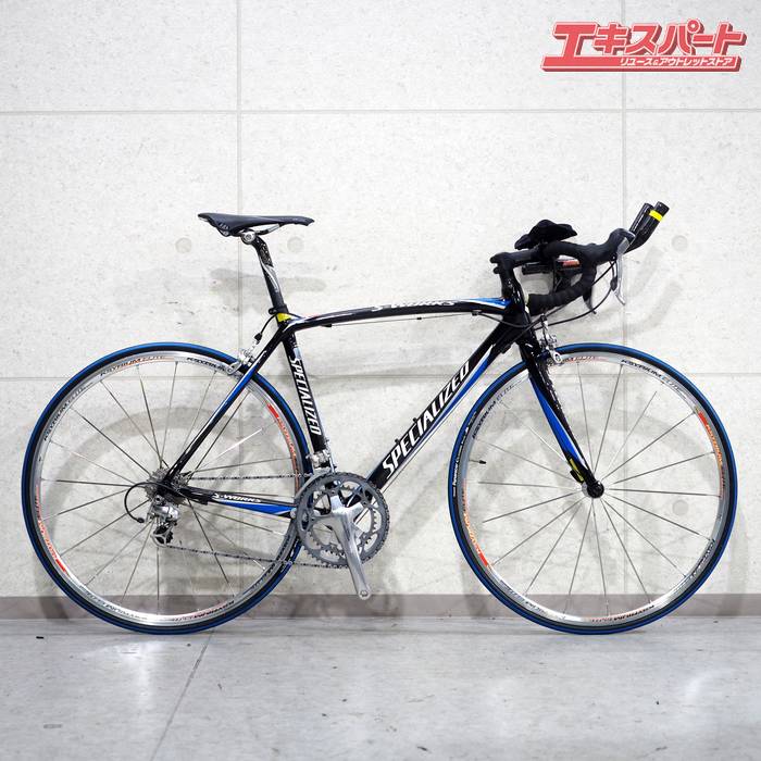 SPECIALIZED S-WORKS TARMAC ULTEGRA 6600 2×10S 2006 スペシャライズド ターマック ロードバイク 戸塚店商品説明メーカー：SPECIALIZED/スペシャライズドモデル名：S-WORKS TARMAC/エスワークス ターマック年式：2006車体色：ブラックフレーム素材：カーボンフォーク素材：カーボンシフター：shimano ULTEGRA ST-6600Fディレーラー：shimano ULTEGRA FD-6600Rディレーラー：shimano ULTEGRA RD-6600クランク：shimano ULTEGRA FC-6600 53/39T 172.5mmスプロケット：shimano ULTEGRA CS-6600 12-25Tブレーキ：shimano ULTEGRA BR-6600ホイール：MAVIC KSYRIUM ELITE 622×13タイヤ：Panaracer CLOSER PLUS 700×23Cハンドルエンド幅：420mmステム長：100mmサイズ：Mトップチューブ長(C-C)：548mm (※ホリゾンタル換算値)シートチューブ長(C-T)：540mm適応身長：172-182cm程度※サイズについては、トップチューブ、シートチューブの実測値から判断しております。　測定誤差によりサイズが前後している可能性がございます。実測重量：7.98kg ※掲載画像状態 【状態】使用に伴うキズや汚れ有りトップチューブに目立つキズ有り、写真でご確認ください。【付属】エクステンションバー【製造番号】WUD254940B【商品コード】126042945001注意事項写真・説明をよくご覧頂き、ご検討をお願いします。画像に写っている物のみです。写っていない物は付属しておりません。販売証明書を発行致します。店頭引取の方へは、当店防犯登録所につき、引取時に防犯登録手続きも可能です。ご希望の方には領収書を発行いたしますので、ご購入後に宛名、但し書き等の記載事項を添えて領収書ご希望の旨お知らせください。発送詳細直接のお引取可能です。お引渡しは弊社指定の住所（神奈川県横浜市戸塚区東俣野町975-1）　 になりますのでご了承下さい。なお長期保管は承れませんので、購入後1週間程度の間にお支払いからお引取まで完了頂ける場合に限らせて頂きます。当社指定の運送会社でのお届けとなります。お届け方法のご指定は承っておりませんのでご了承下さい。発送の場合は以下のとおりです。フロントタイヤ等一部分解しての配送になります。組立は落札者様にてお願い致します。こちらの商品については地域によっては到着までお日にちを頂く場合がございます。尚、法人宛ての時間指定配送は不可です。梱包にリサイクルダンボールを使用させて頂く場合がございます。　 モニターの発色具合によって実際のものと色が異なる場合があります。 タイトルの中古ー未使用について 通常の新品販売と異なるルートから仕入れた新品や、一度販売されたものの、未開封のまま一度も利用されずに再販する商品となります 北海道・沖縄県・離島への配送について 一部の商品に関しまして、北海道・沖縄県・離島への配送をお受けできない場合がございます。 誠に恐れ入りますが、当店にてご注文確認後にご連絡させていただき、ご注文はキャンセルとさせていただきます。