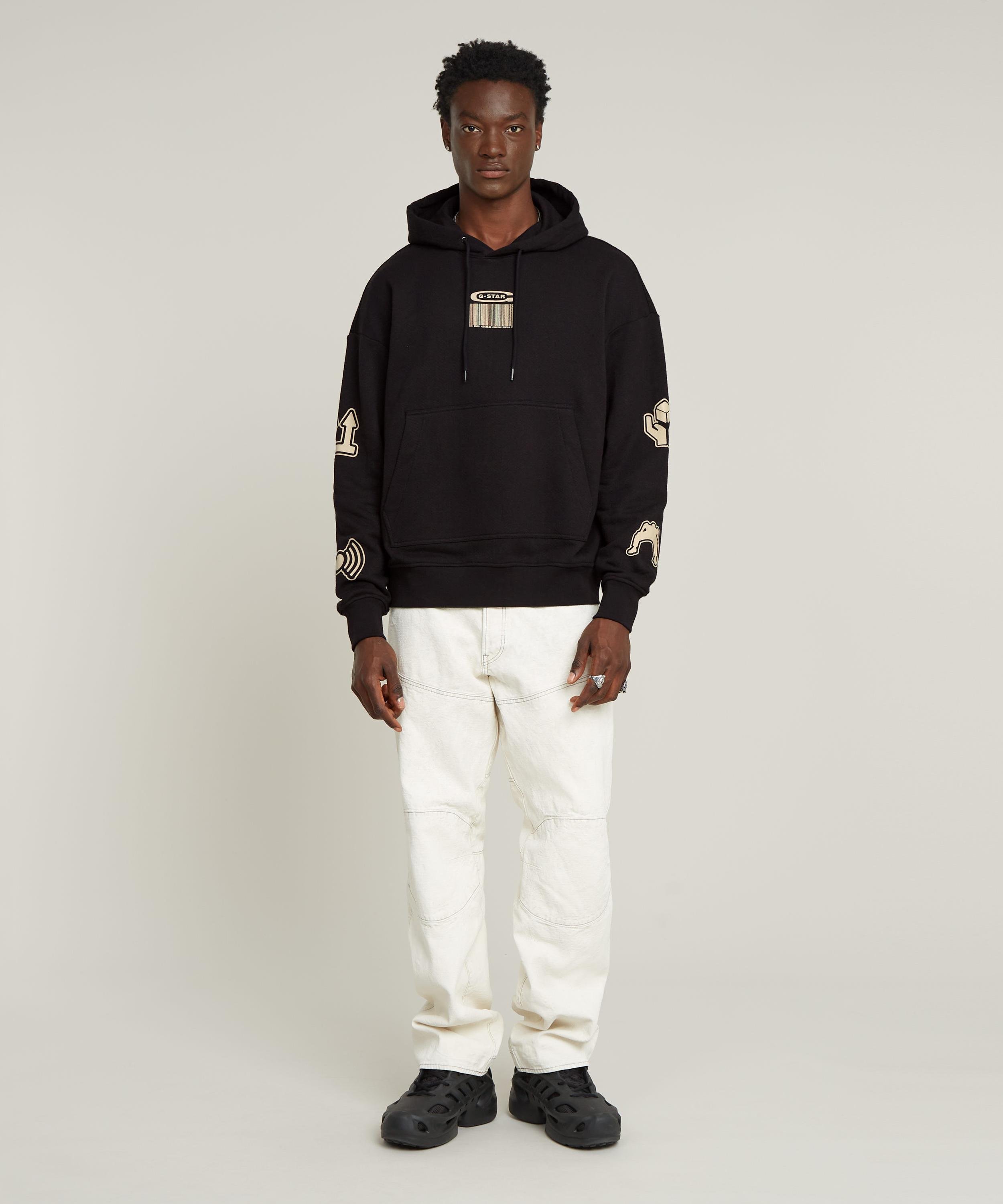 【公式ショップ】MULTI LOGO LOOSE HOODED SWEATER/マルチグラフィックブランドロゴオーバーサイズパーカー ジースターロゥ トップス パーカー・フーディー ブラック