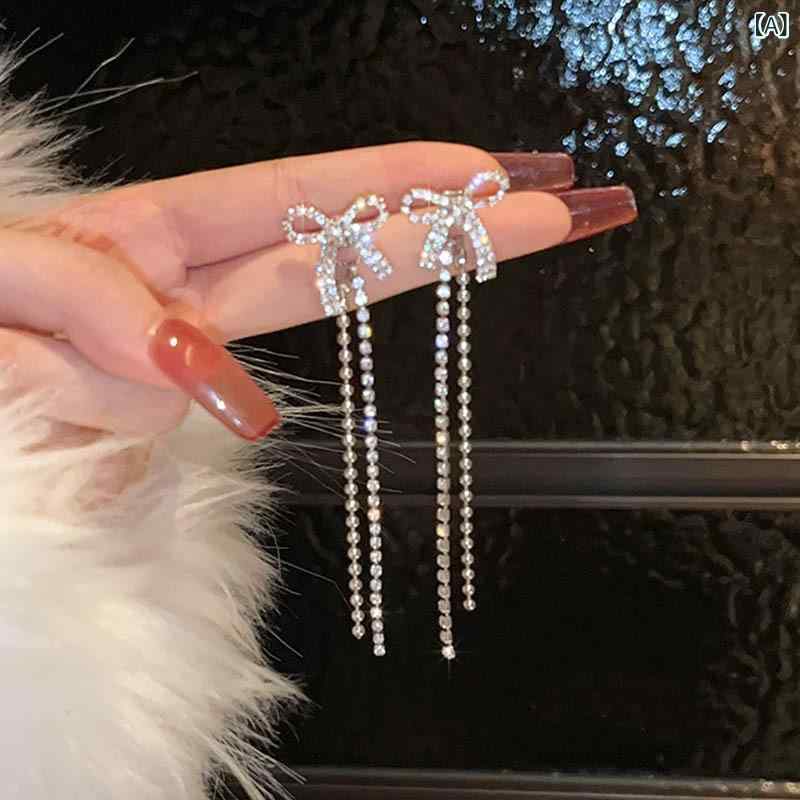 ピアス レディース 二次会用 蝶結び タッセル付き 両用タイプ フープイヤリング 揺れる スタッド式 ジルコニア 輝き 個性的 上品 かわいい 大人かわいい 韓国風 アクセサリー 耳飾り 金属アレルギー対応 軟骨ピアス おしゃれ シンプル カジュアル デイ