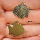 【ハンドメイドパーツ】素材アンティーク風・メタルチャーム・金古美・魚【c1a4p】