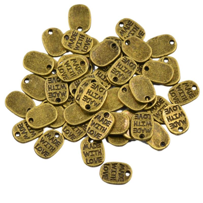 50個ヴィンテージチベットアンティークブロンズゴールドハートオーバルラブチャームで作られた