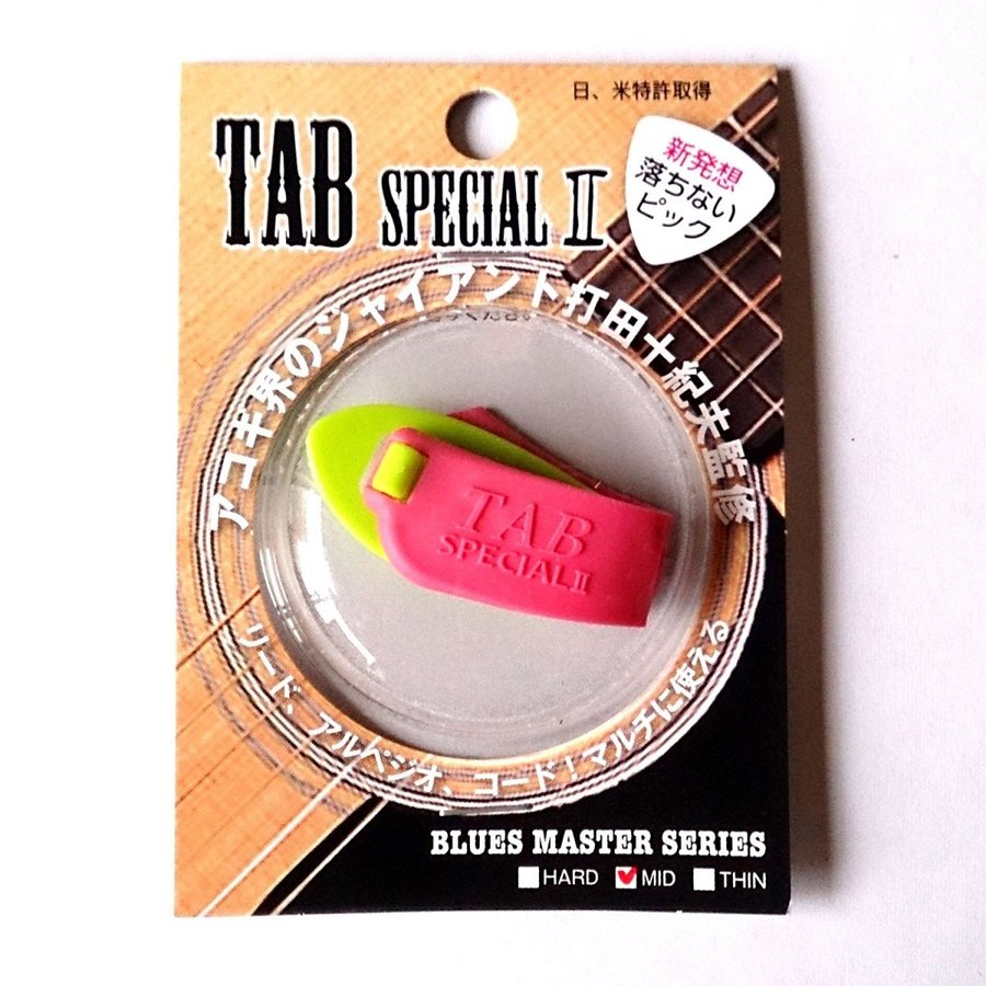 TAB サムピック TAB Special 2 TP112-KG×P (MEDIUM) タブ ピック スペシャル2 新発想のサムピックとしてご愛顧いただいております「TAB Special」が、お客様のニーズに答えるべく「TAB Special II」としてモデルチェンジ。硬さが、THIN、MEDIUM、HARDの3タイプ。(3タイプ × 2色 = 全6タイプ)ベルトが切れづらくなり、デザインも洗練されました。パッケージも一新、ブリスターを使用し商品を見やすくしました。※従来の旧モデルの硬さは「TAB Special II」のMEDIUMにほぼ相当します(ほんの少しだけ「TAB Special II」の方が硬めではあります)。 ※こちらの商品はメール便、もしくは定形外郵便（ポスト投函、配送時の補償なし）にて発送いたします。また、商品はお取り寄せ商品となりますので、リアルタイムに在庫状況を反映できない場合がございます。売り切れの際はご了承くださいませ。メーカー在庫切れや廃番商品など納期が遅れる場合にはメールにてお知らせいたします。確実な在庫状況は事前にお問い合わせ下さいませ。 2