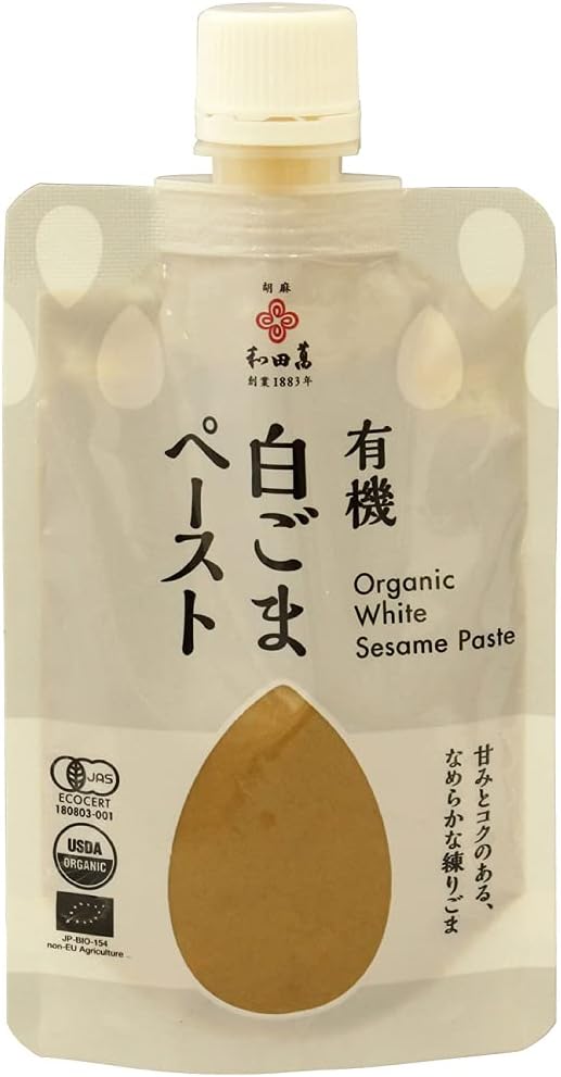 有機白ごまを特別な臼で丁寧に練り上げたごまペースト。白ごま特有のコクと甘味を引き出しました。胡麻豆腐、ごまだれ、ドレッシング、中華料理の食材として、また、同量のハチミツや砂糖と一緒トーストにぬるのもおすすめです。原材料：有機白ごま（エチオピア又はエジプト）内容量：80g　数量：12パック　販売者：和田萬