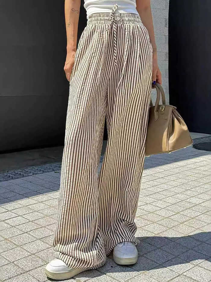 樂天商城 - ストライプパンツ レディース ワイドパンツ ストレート ストライプ柄 新作 夏服 春物 ハイウエスト 着痩せ 体型カバー ゆったり 縦縞 カジュアル 綺麗め 落ち感 ロング丈 丈長め リラックス 部屋着 外出着 ウエストゴム 楽ちん