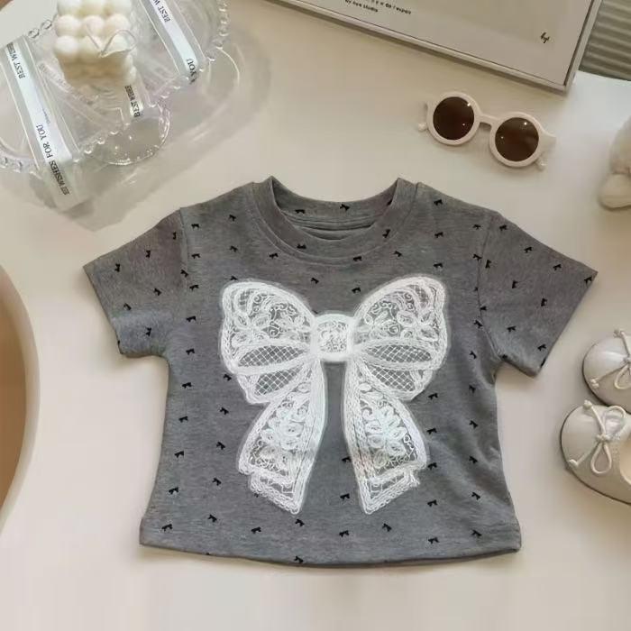 Tシャツ 女の子 キッズ 子供服 子ども ジュニア 半袖 カットソー トップス プルオーバー クルーネック 丸首 蝶々結び リボン 綿 コットン 薄手 伸縮性 通気性 カジュアル かわいい おしゃれ 春夏