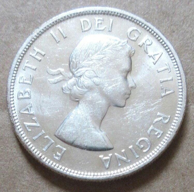 1957年カナダ銀貨1ドル硬貨。UNCセミキー、ナイスグレード1ドル（D426、D427）