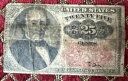 1874 年 25 セント分数通貨ヴィンテージ。背中にテープで留めてあります