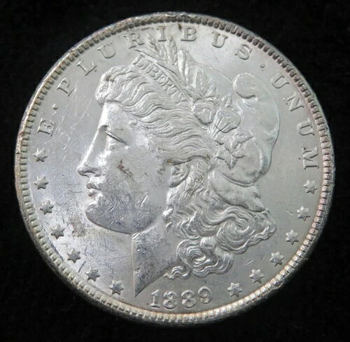 1889 Morgan Silver Dollar * Better Grade * Nice Eye Appeal * 4550商品について認証：未認証流通/未流通：不明コイン：モルガン組成：銀額面：1ドル純度：0.9等級：未評価鋳造所：フィラデルフィア鋳造方法：ビジネス発行年：1889年注意事項※以下の注意事項をご理解のうえ、ご購入ください■ 鑑定済みコイン・紙幣について各種コイン・紙幣の鑑定機関（NGC、PCGS、PMGなど）は、収集品の真贋鑑定およびグレーディングを行う専門機関です。鑑定後の商品は、専用ケース（スラブ）に封入され、状態を示すグレードが付与されます。■ グレードについてグレードはコイン・紙幣自体の状態を評価するものであり、ケース自体の品質や状態を保証するものではありません。製造・輸送時の影響により、以下のような状態が発生する場合がございます。- 軽微なスレ傷・拭き傷（特に光の角度で見えるもの）- ケース内部のホコリ・小さな異物（鑑定機関の検品基準を満たしている場合）- ラベルのズレ・わずかな傾きこれらは鑑定機関の基準内であり、返品・交換の対象とはなりませんのでご了承ください。■ ラベルの種類について各鑑定機関では、コイン・紙幣の状態や鑑定の結果に応じて異なるラベルが付与されます。- 通常ラベル（Standard/Regular）：一般的なグレード付き鑑定済みコイン・紙幣- オーセンティック（Authentic）：グレードなしで真贋のみ保証- 詳細グレード（Details）：クリーニング跡やエッジのダメージがあるが本物と認定- 特別ラベル（Special Label）：記念版や特定のデザインの限定ラベル - 例：NGC「Early Releases」「First Releases」、PCGS「First Strike」 などグレードやラベルの種類は、商品画像および説明文をご確認のうえ、ご購入ください。■ 在庫状況について当店の商品は海外から取り寄せております。ご購入のタイミングによっては在庫切れとなる場合がございます。その際はご連絡のうえ、ご注文をキャンセルさせていただく場合がございますので、あらかじめご了承ください。■ ご注文後のキャンセルについてご注文と同時に商品のお取り寄せを開始するため、お客様都合によるキャンセルは承っておりません。■ 配送についてお届けまでに通常2〜3週間ほどかかります。海外の祝日や天候、税関手続きにより通常より配送が遅れる可能性がございます。■ 保証について商品説明に英語で「保証（warranty）」と記載があっても、日本国内では適用されませんのでご了承ください。 当店では、商品到着後7日以内の初期不良に限り、対応させていただきます。 （返品規約の詳細については、楽天市場内の会社概要欄下部をご参照ください。）■ 商品の色・素材感について撮影環境やモニター設定により、実際の商品と色味や質感が異なる場合がございます。■ 価格変動について希少性の高い商品は市場価格の変動により、追加料金をお願いする場合がございます。追加料金に同意いただけない場合には、ご注文のキャンセルが可能ですので、ご安心ください。■ その他サービスについて海外製品の輸入代行も承っております。ショップに掲載されていない商品でもお探し可能ですので、お気軽にご相談ください。尚、業者販売（業販）や複数購入の場合、割引対応も可能です。ご希望の方はお問い合わせください。