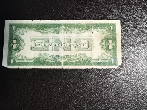 1.00 1934年：銀貨証明書 裏面が反転したエラー 希少だがグレードが低い 損傷あり