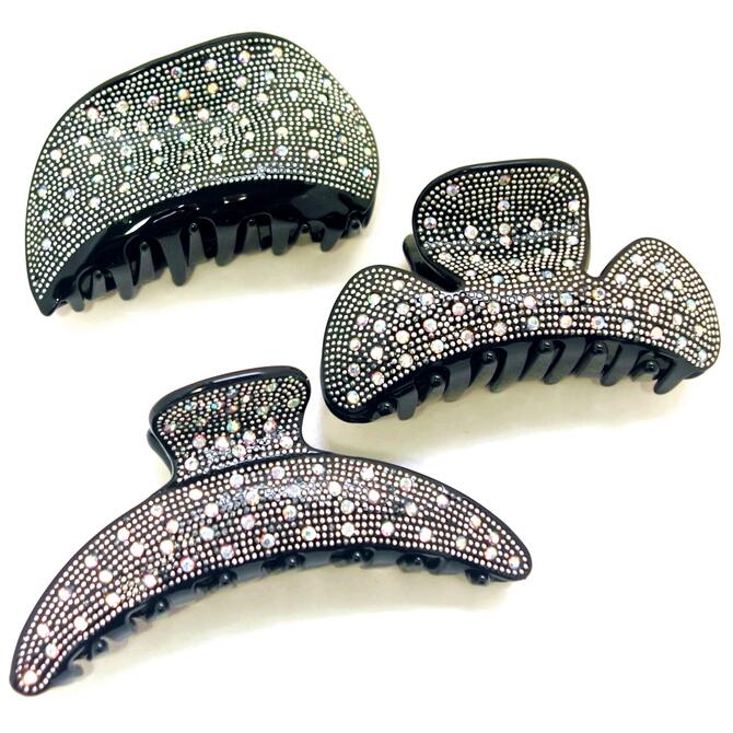 やや大きめ髪どめ バンス。ハンドメイド。 びっしりと埋め込まれたシルバースタッズと小粒オーロラ石。持ち手の上にもキラキラ☆ ユニークな形からシンプルな形まで曲線が美しいエレガントなヘアクリップです。 シックなデザインで日常のおしゃれからお出...