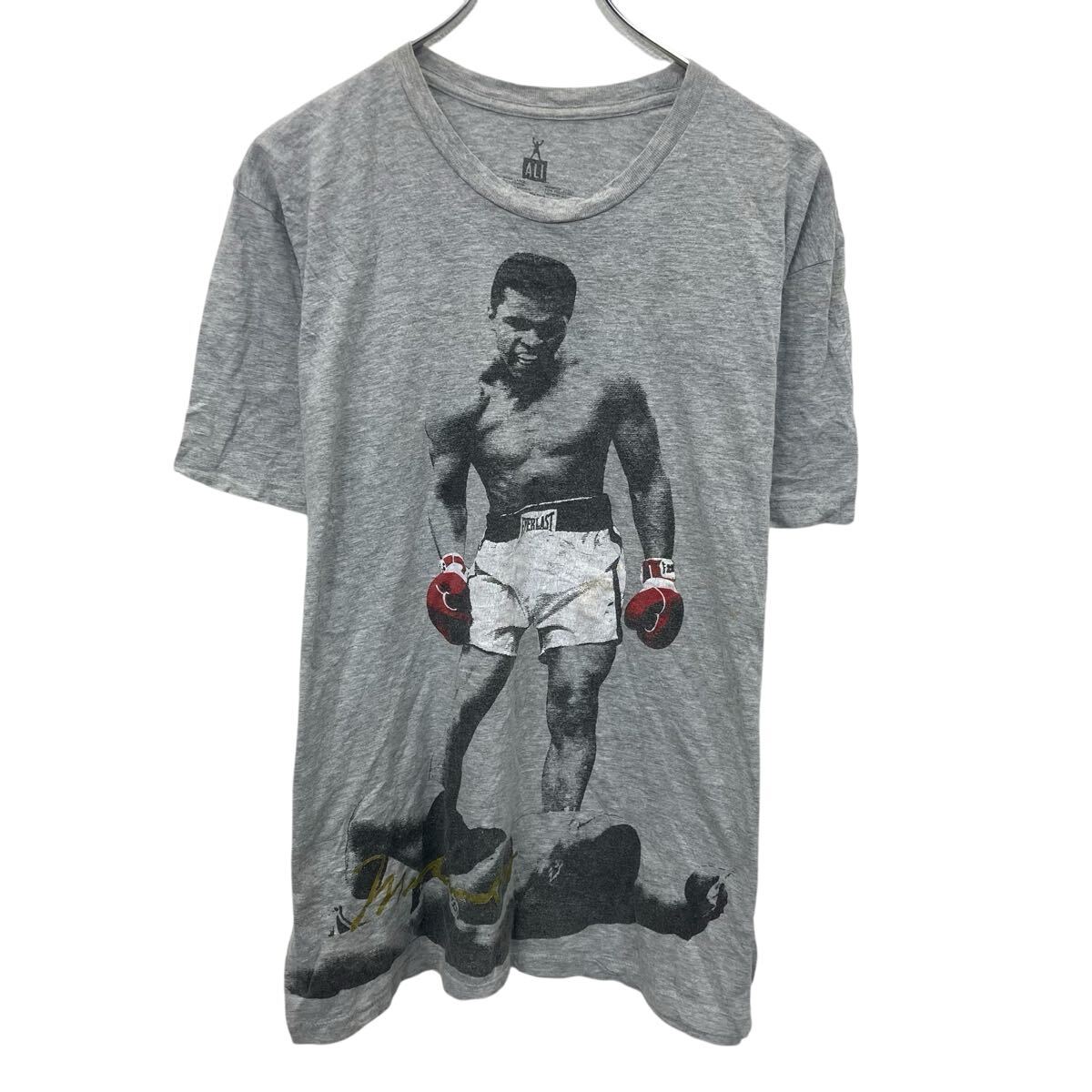 【中古】【古着】 ALI 半袖 プリントTシャツ L グレー アリ プルオーバー ビックプリント モハメド・ア..