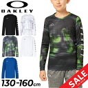 オークリー 長袖Tシャツ キッズ ジュニア OAKLEY キッズウェア 子供服 130cm 140cm 150cm 160cm プリントT トレーニング スポーツウェア 吸汗速乾 UPF15+ 子ども こども クルーネック 長袖シャツ ロンT 黒 白 青 ブラック ホワイト ブル- トップス スポーツウエア/FOA405771