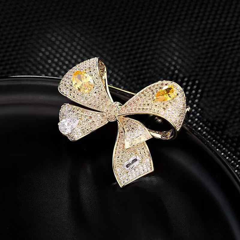 ブローチ レディース 女性用 銅製 ジルコニア リボン ゴールド ピンク ブルー パープル スーツ コート ..