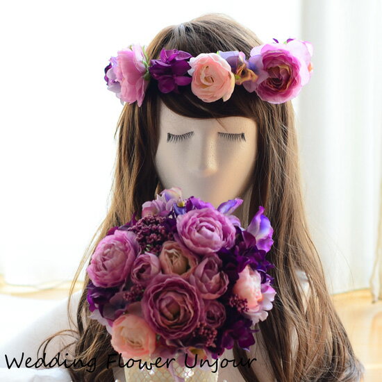 Wedding Flower Unjourの商品をご覧頂きありがとうございます(*^-^*) こちらは、アートフラワー（造花）を使用したブーケと花冠です。 パープル系のラナンキュラス、スイートピー、紫陽花等のたくさんのお花を一つに束ねたブー ケです。 紫の濃淡が、大人っぽい印象を与えるだけでなく、可愛く、上品な印象も与えます。 光沢のあるパープルのフランス製リボンを使用してステキにまとめました。 ブーケ直径：約20cm 花冠：花の付いてる部分53cm（後ろのリボンでサイズ調節できます） ブートニア付 フランス製リボン使用 高品質なアートフラワーを使用しています。 注文後にお作り致します。Wedding Flower Unjourは高品質なアートフラワーを使用した商品をスッタフが一つ一つ丁寧にお作りしています。