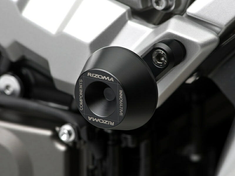 ? Structural part in aluminum machined from billet? Slider in Delrin? Made specifically for each bike? Aesthetic lightness and functionality