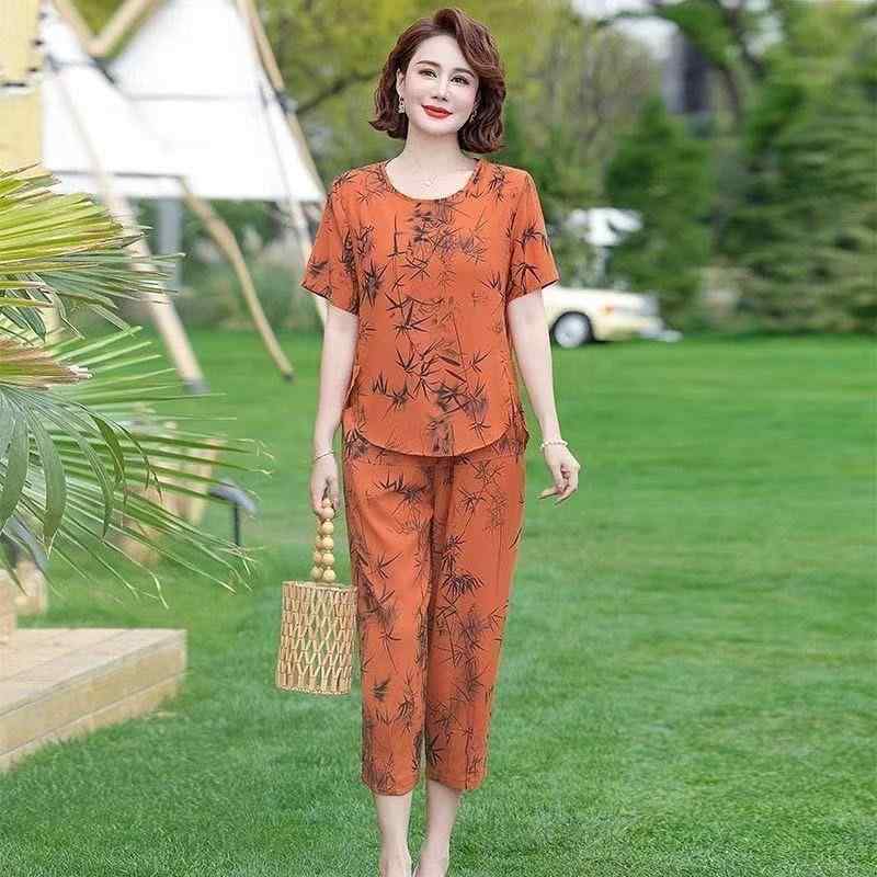 樂天商城 - Tシャツ レディース 半袖 快適 夏 9分丈 ワイドパンツ セット 花柄 プリント ルーズ 丸首 高級感 ポリエステル 細見え カジュアル 杏 緑 橙 ミドル