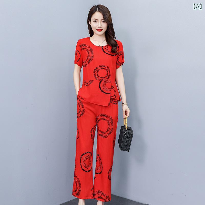 Rakuten - 夏の 女性の 2つの セットは 半袖の t シャツの 上着の プリントの高 腰の ズボンの 中で 高齢の お母さんは カジュアルな 外 着を 詰めます。