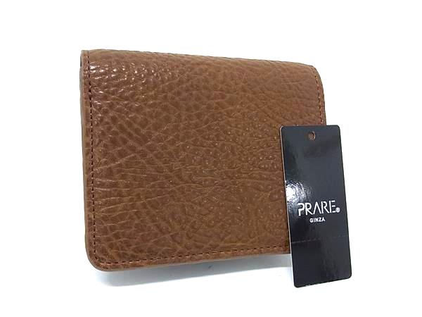 商品情報 ブランド名 PRARE プレリー 状態ランク Aランク(美品) ライン カラーブラウン系 素材 レザー サイズ(cm) W 約12cm　H 約10cm　D 約3.5cm サイズ(inch) W 約4.72inch　H 約3.94inch　D 約1.38inch ポケット中 ポケット×1　札入れ×2　小銭入れ×1　カード入れ×3 付属品画像内にあるものが全てになります シリアル及び刻印 状態擦れ小　汚れ小押し跡小 □□□　状態ランクについて　□□□ 【N】　新品 【S】　未使用品（展示品など） 【A】　傷汚れが少なく状態の良い商品 【B】　程よい使用感や多少の傷、汚れはあるが程度良好の商品 【C】　使用感の他、目立つ傷や汚れが見れる商品 【D】　かなり大きな痛みがある難あり商品 ※記載させていただきました状態説明・ランクは、あくまで弊社基準にて判断したものとなります。 その為、個人差による主観の差が生じる場合も御座いますので、あらかじめご了承頂いた上で、ご検討下さいませ。 pleasure（株式会社peace）が販売しています。 出品中の商品につきましては全て正規品(本物）でございます。 （古物許可証第305521507463東京都公安委員会）