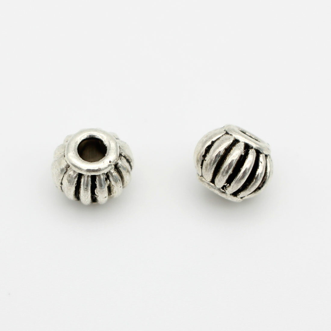 【10個パック】銀古美 スペーサー (球形) sgy-916-a-10p [最大部外径約7.8mm×厚み約6.3mm、穴直径約2.5mm] (アクセサリーパーツ ネックレス パーツ 円柱 ハンドメイド 材料 素材 金具 アンティークシルバー 銀 シルバー 装飾 銅）
